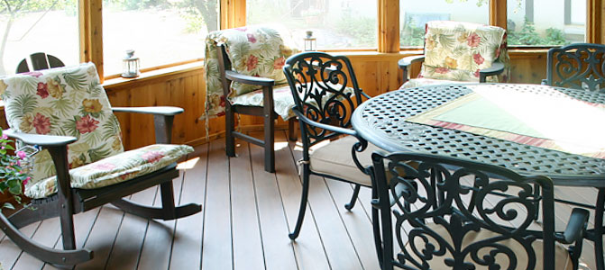 Screened porch enclosure with furniture, covered front porch